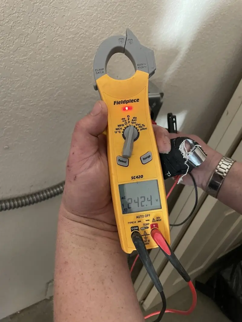 Voltage testing with clamp meter during Outlet Installation in Chatham